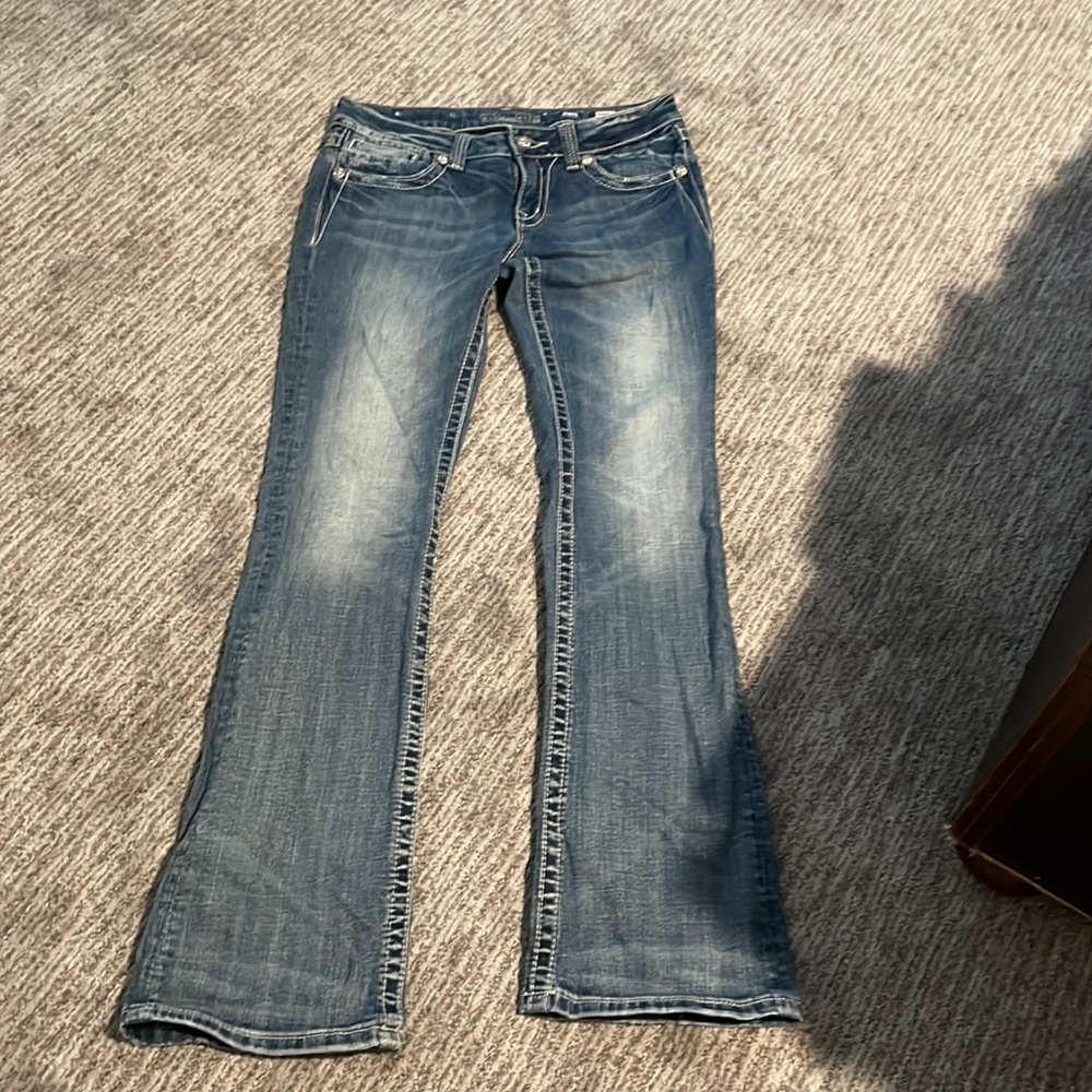 Miss Me boot cut jeans with diamond pockets and on the back waist band.